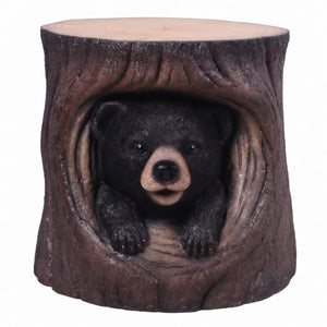 Heinimex Black Bear Cub in Hollow Trunk Table commercial accent table, realistic faux-wood bark and textured black fur finish, rustic woodland lodge style front view