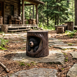 Heinimex Black Bear Cub in Hollow Trunk Table commercial accent table, realistic faux-wood bark and textured black fur finish, rustic woodland lodge lifestyle photo