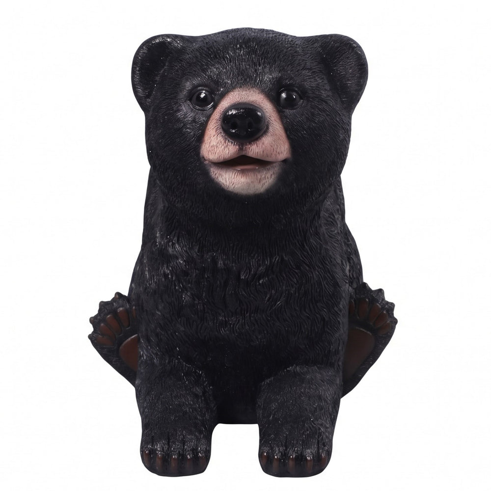 Heinimex Black Bear Cub Stool commercial seating prop, realistic textured black fur finish with integrated smooth brown seat, rustic woodland lodge style angle view