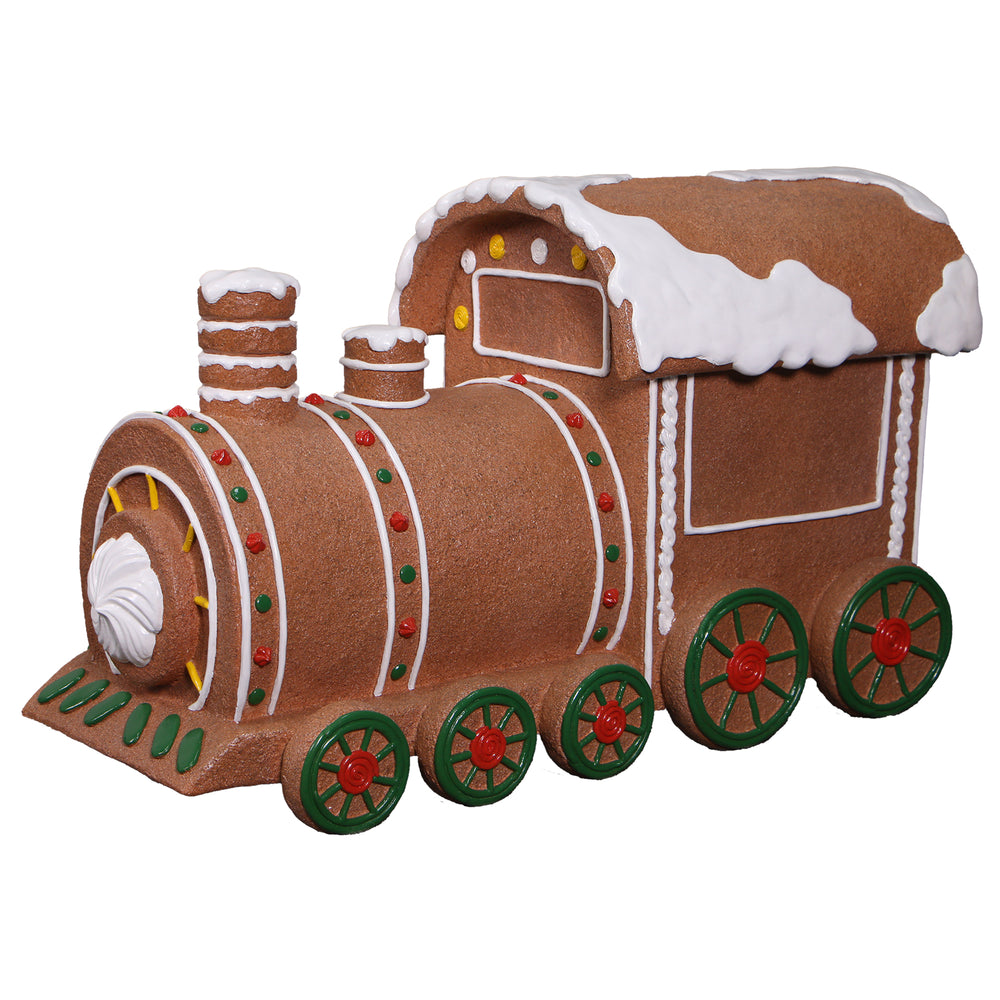 Heinimex Gingerbread Train Christmas decor, textured gingerbread and painted icing finish with snow accents, playful holiday display angle view
