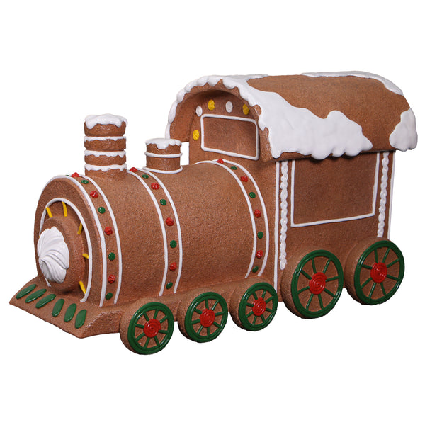 Heinimex Gingerbread Train Christmas decor, textured gingerbread and painted icing finish with snow accents, playful holiday display angle view