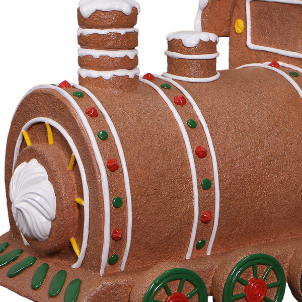 Heinimex Gingerbread Train Christmas decor, textured gingerbread and painted icing finish with snow accents, playful holiday display closeup detail
