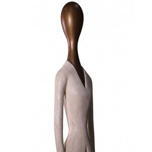 Heinimex 80-inch Paya elongated human figure statues, textured stone-look and smooth wood-tone finish, modern minimalist gallery style close up detail