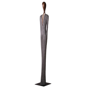 Heinimex 85-inch Payo elongated human figure statues, textured stone-look and smooth wood-tone finish, modern minimalist gallery style angle view