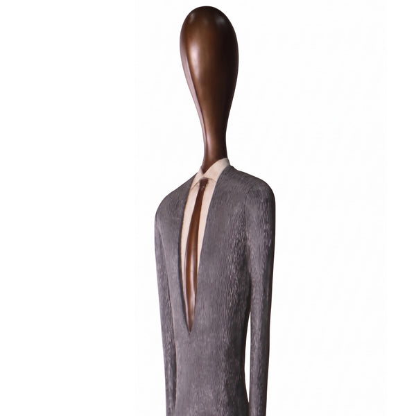 Heinimex 85-inch Payo elongated human figure statues, textured stone-look and smooth wood-tone finish, modern minimalist gallery style closeup view