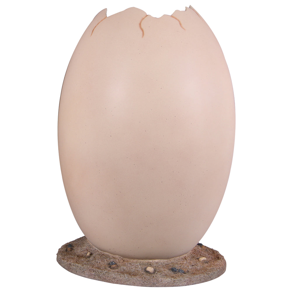 Heinimex Peekaboo Egg without top photo op, smooth speckled beige finish on textured rock base, immersive prehistoric playground style front view