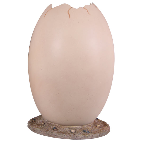 Heinimex Peekaboo Egg without top photo op, smooth speckled beige finish on textured rock base, immersive prehistoric playground style front view
