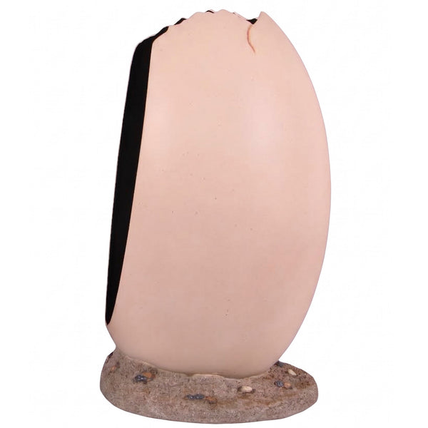 Heinimex Peekaboo Egg without top photo op, smooth speckled beige finish on textured rock base, immersive prehistoric playground style side view