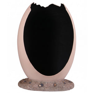 Heinimex Peekaboo Egg without top photo op, smooth speckled beige finish on textured rock base, immersive prehistoric playground style back view
