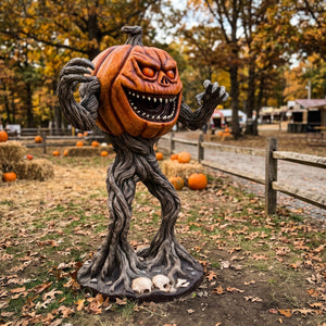 Heinimex Pumpkin Monster 5ft Halloween decor, realistic textured orange pumpkin with gnarled twisted root body and skull base, eerie outdoor haunted patch display lifestyle photo