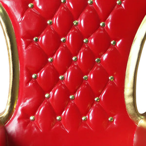 Heinimex Royal Throne Christmas decor, metallic gold leaf finish with tufted red upholstery, classic luxury holiday display style close up detail