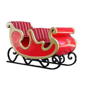 Heinimex Santa's Sleigh - Foursome Christmas decor, vibrant red finish with gold trim and tufted seating, classic luxury holiday display style right angle view