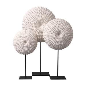 Heinimex Sea Urchin on Stand centerpiece, textured white stone finish with black metal stand, modern coastal luxury style on set