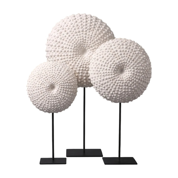 Heinimex Sea Urchin on Stand centerpiece, textured white stone finish with black metal stand, modern coastal luxury style on set
