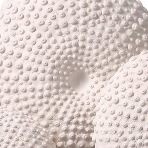 Heinimex Sea Urchin on Stand centerpiece, textured white stone finish with black metal stand, modern coastal luxury style close up detail