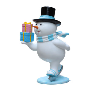 Heinimex Skating Snowman Family - Father Christmas decor, glossy painted finish with blue accents and colorful gifts, playful winter wonderland display style angle view