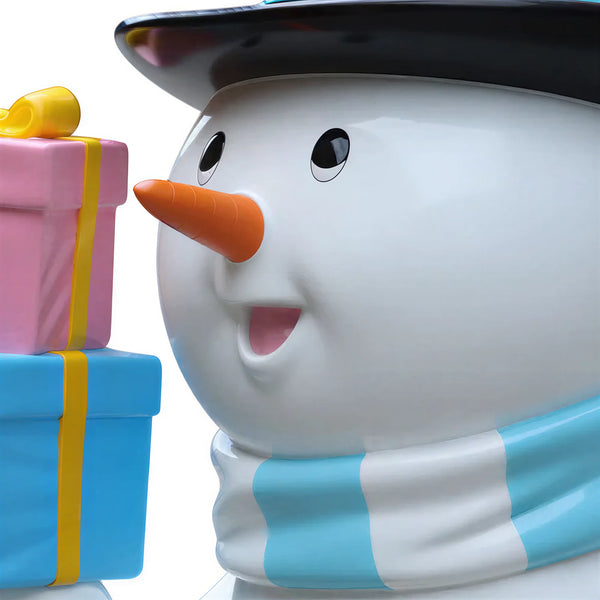 Heinimex Skating Snowman Family - Father Christmas decor, glossy painted finish with blue accents and colorful gifts, playful winter wonderland display style close up detail