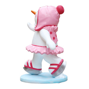 Heinimex Skating Snowman Family - Girl Christmas decor, glossy painted finish with pink accents and tutu, playful winter wonderland display style left side view