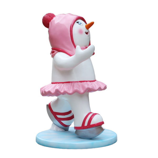 Heinimex Skating Snowman Family - Girl Christmas decor, glossy painted finish with pink accents and tutu, playful winter wonderland display style side view