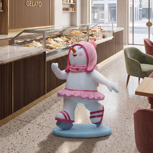 Heinimex Skating Snowman Family - Girl Christmas decor, glossy painted finish with pink accents and tutu, playful winter wonderland display lifestyle photo