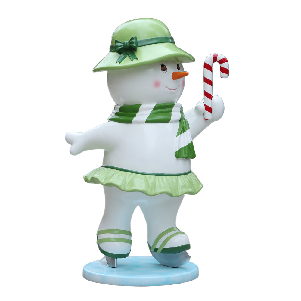 Heinimex Skating Snowman Family - Mother Christmas decor, glossy painted finish with green accents and candy cane, playful winter wonderland display style side view