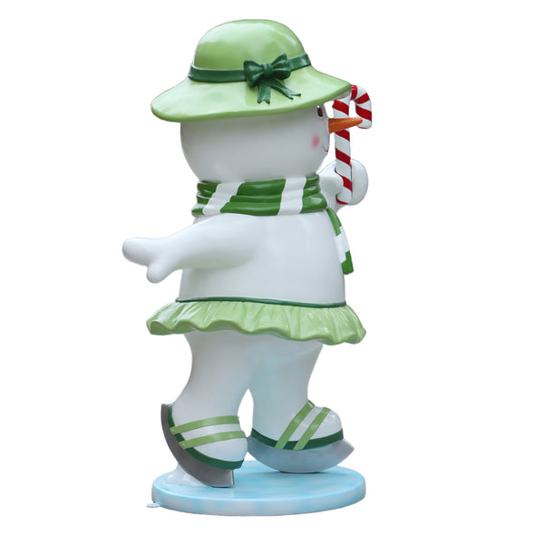 Heinimex Skating Snowman Family - Mother Christmas decor, glossy painted finish with green accents and candy cane, playful winter wonderland display style angle back view