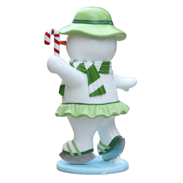 Heinimex Skating Snowman Family - Mother Christmas decor, glossy painted finish with green accents and candy cane, playful winter wonderland display style back view