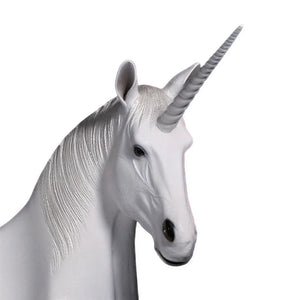 Functional and decorative white unicorn bench featuring a contoured seating area, a textured silver-grey mane, and a resting pose.