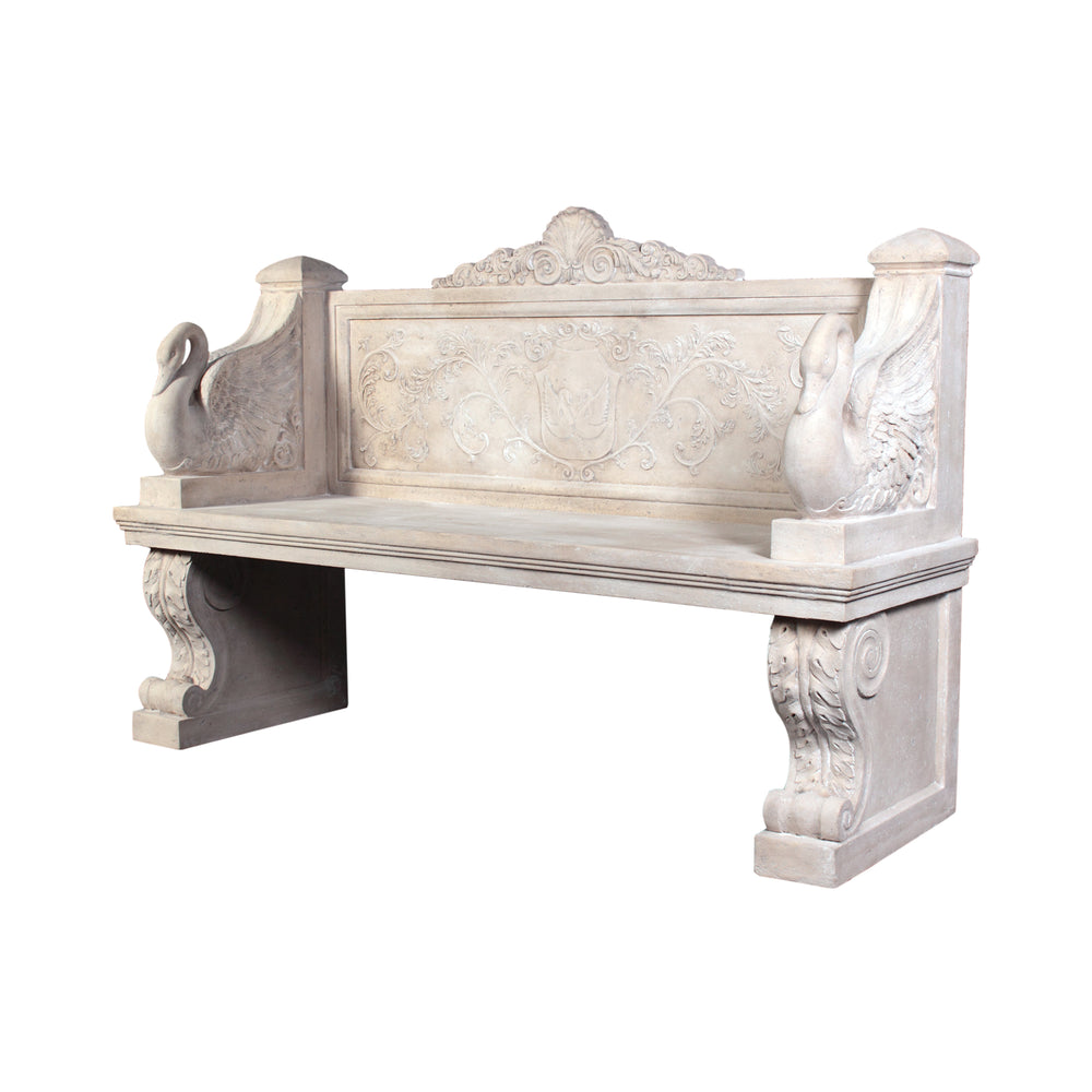 Decorative light stone-colored bench featuring sculpted swans on the armrests, an intricate floral and crest relief on the backrest, and thick scrolled pedestal legs.
