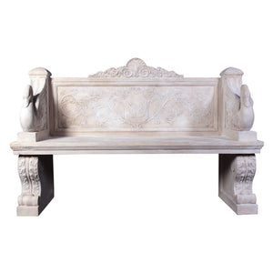 Decorative light stone-colored bench featuring sculpted swans on the armrests, an intricate floral and crest relief on the backrest, and thick scrolled pedestal legs.