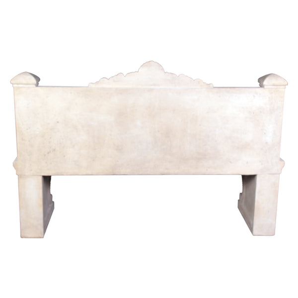 Decorative light stone-colored bench featuring sculpted swans on the armrests, an intricate floral and crest relief on the backrest, and thick scrolled pedestal legs.