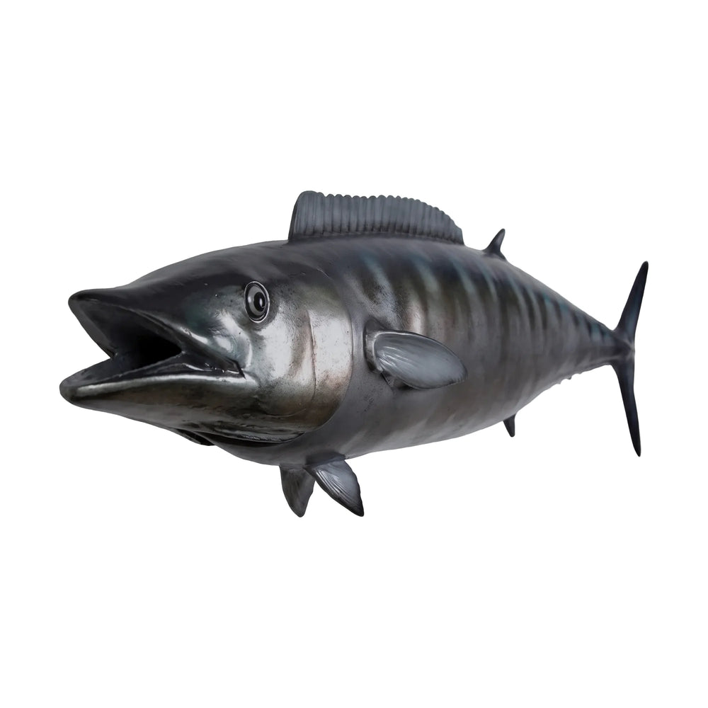 Decorative sculpture of a Wahoo fish featuring a streamlined body, a metallic silver finish, and dark vertical stripes along its back.