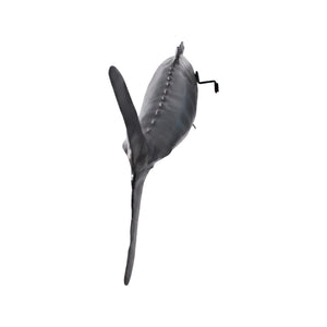 Decorative sculpture of a Wahoo fish featuring a streamlined body, a metallic silver finish, and dark vertical stripes along its back.