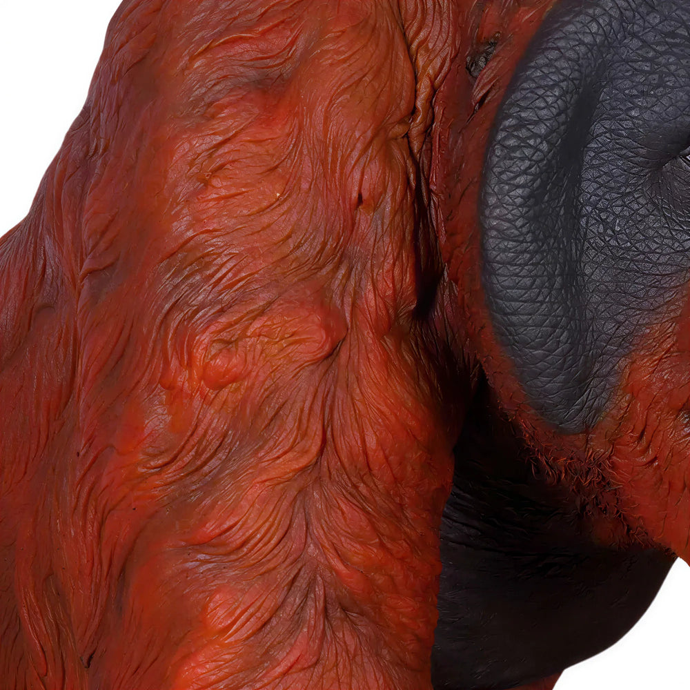 Decorative statue of a walking male orangutan featuring textured reddish-brown fur, a dark face with prominent cheek pads, and a knuckle-walking stance.