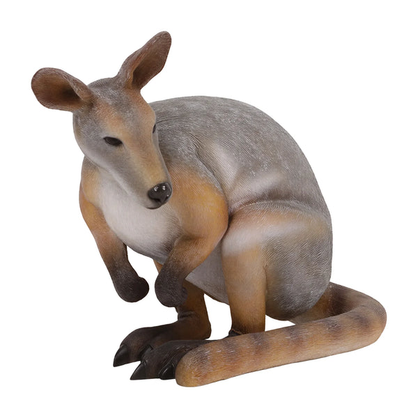 Decorative statue of a crouching wallaby featuring a grey and tan coat, upright ears, and a thick tail resting on the ground.