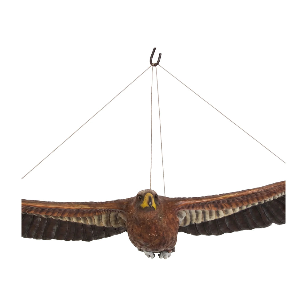 Decorative hanging sculpture of a wedge-tailed eagle in flight, featuring textured brown feathers, a wide wingspan, and a bright yellow beak.
