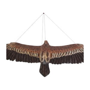 Decorative hanging sculpture of a wedge-tailed eagle in flight, featuring textured brown feathers, a wide wingspan, and a bright yellow beak.
