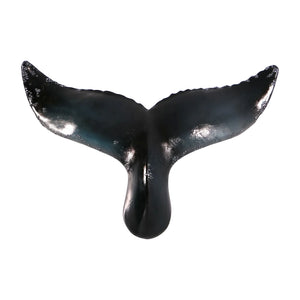 Decorative wall-mounted whale tail sculpture featuring a glossy dark blue and black finish with textured edges.
