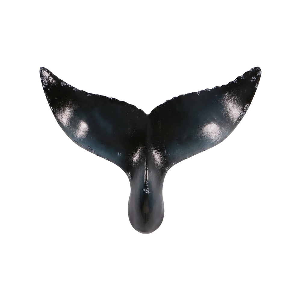 Decorative wall-mounted whale tail sculpture featuring a glossy dark blue and black finish with textured edges.