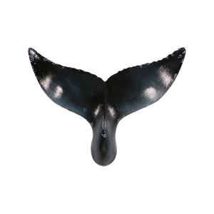 Decorative wall-mounted whale tail sculpture featuring a glossy dark blue and black finish with textured edges.