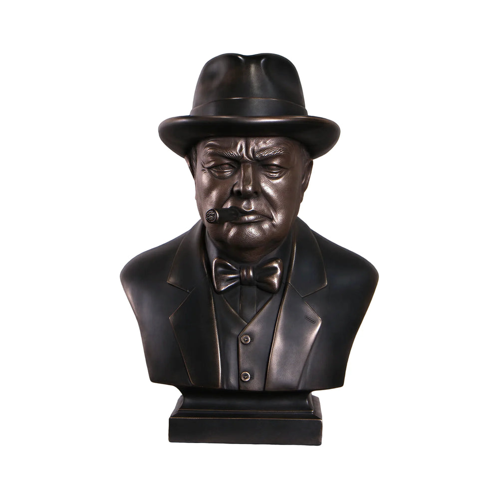 Decorative dark bronze-finished bust of Winston Churchill wearing a hat and bow tie, with a sculpted cigar in his mouth.