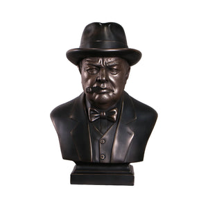 Decorative dark bronze-finished bust of Winston Churchill wearing a hat and bow tie, with a sculpted cigar in his mouth.