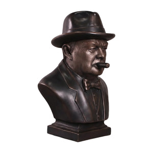 Decorative dark bronze-finished bust of Winston Churchill wearing a hat and bow tie, with a sculpted cigar in his mouth.