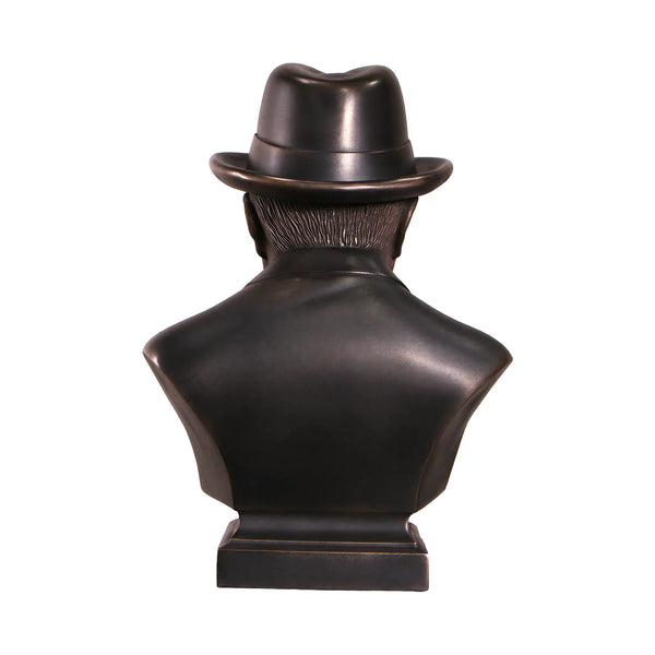 Decorative dark bronze-finished bust of Winston Churchill wearing a hat and bow tie, with a sculpted cigar in his mouth.
