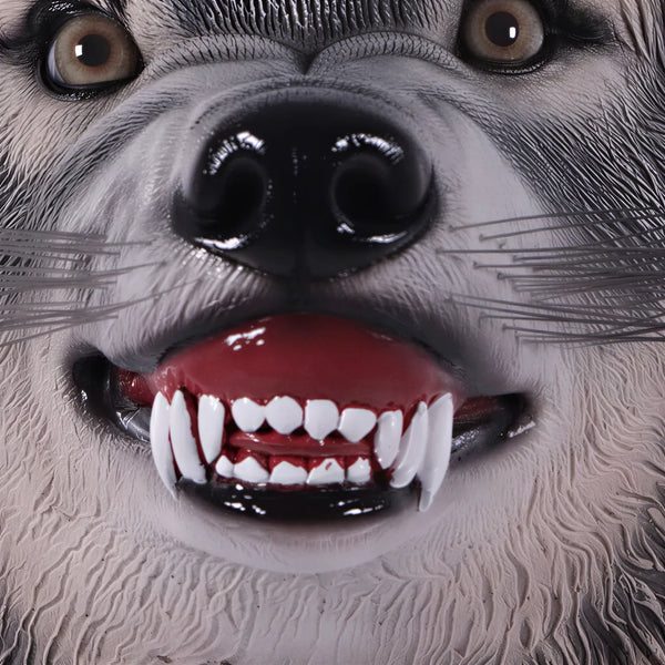 Decorative wall-mounted wolf head sculpture featuring realistic painted fur, an open mouth with teeth, and wire whiskers.