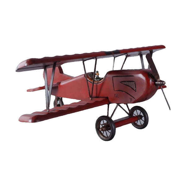 Decorative wooden biplane model featuring a dark red finish, spoked wheels, and a small pilot figure.