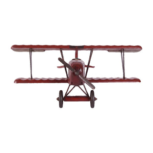 Decorative wooden biplane model featuring a dark red finish, spoked wheels, and a small pilot figure.