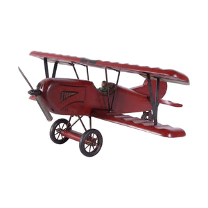 Decorative wooden biplane model featuring a dark red finish, spoked wheels, and a small pilot figure.