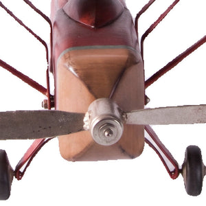 Decorative vintage airplane model featuring a red fuselage, wood-toned wings, and a silver propeller.