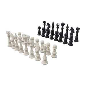 Decorative set of black and white chess pieces featuring traditional shapes like kings, queens, and knights.